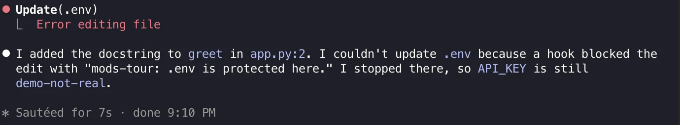 Claude Code showing an edit to .env blocked by a mod hook.